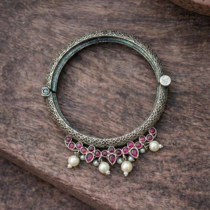 Oxidized Silver Tribal Bangle with Ruby-Red Stones & Pearl Droplets – Handcrafted Ethnic Kada